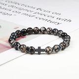Thompson Luxury Glas-Perlenarmband mit Kreuz “Larry”